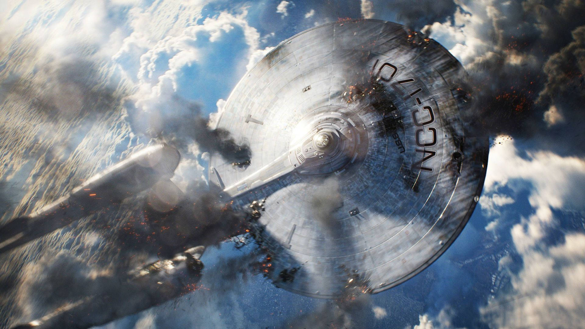 darkness 桌布 壁紙 — 一艘帶有「NCC-1701」標記的受損星艦穿過暴風雲層墜落，留下煙霧和火焰痕跡。