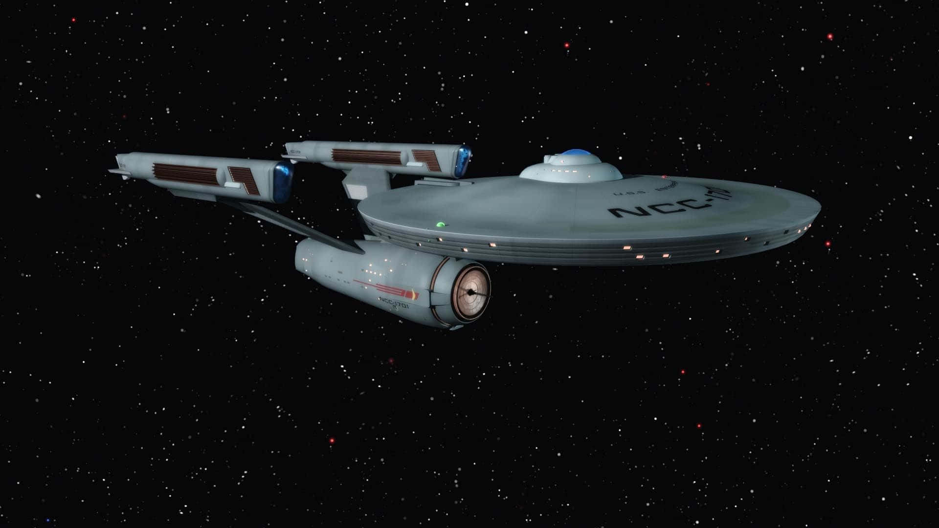 Star Trek Enterprise 桌布 壁紙 — 一艘帶有NCC-1701標誌的時尚灰色星艦在黑色宇宙背景下滑過星場。