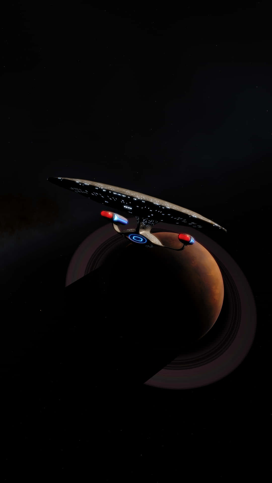 星艦在外太空靠近一顆帶光環的行星飛行。 — 星際爭霸戰 GIF 壁紙