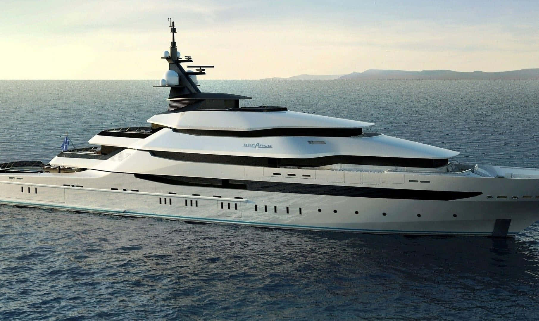 Yacht 桌布 壁紙 — 一艘時尚的白色豪華遊艇帶有黑色點綴，在柔和的金色天空下滑過平靜的藍色水域。