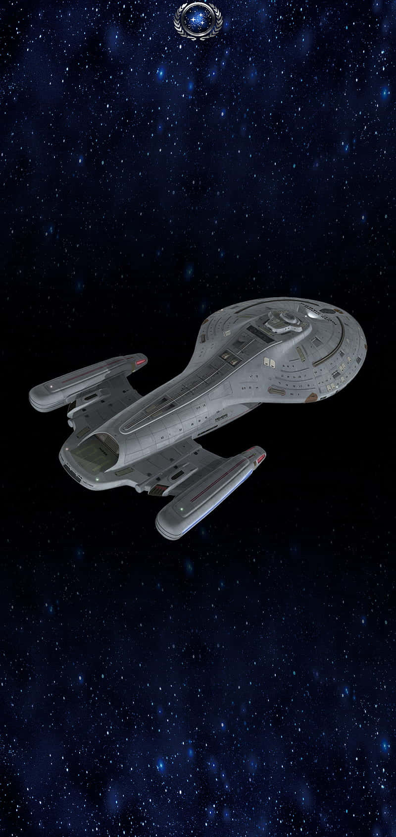 銀色星艦漂浮在深藍色星空中，伴隨著閃爍的星星。 — 星際爭霸戰 GIF 壁紙
