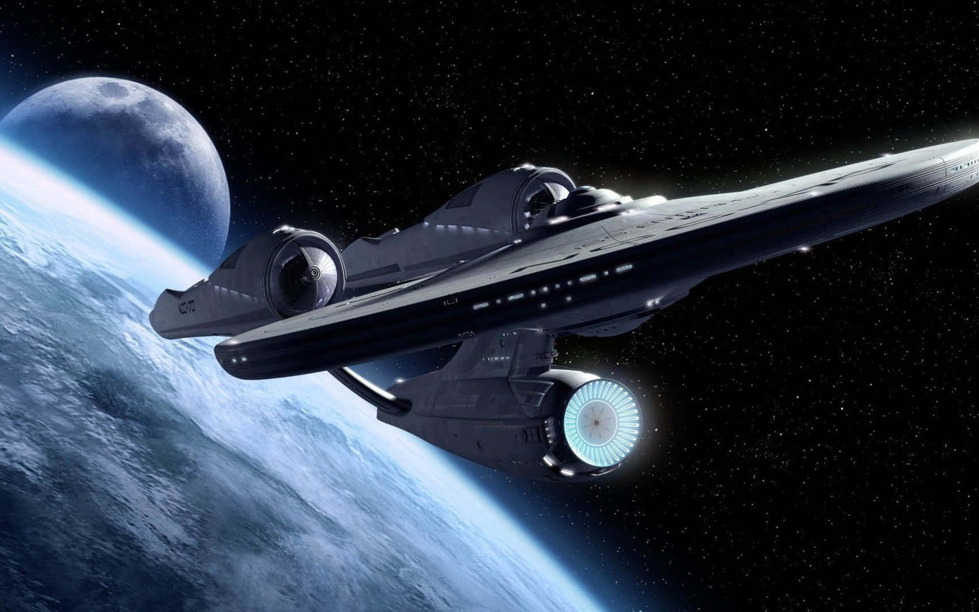 Star Trek Enterprise 桌布 壁紙 — 一艘流線型星艦在繁星虛空中掠過一顆帶有月亮的藍色行星。