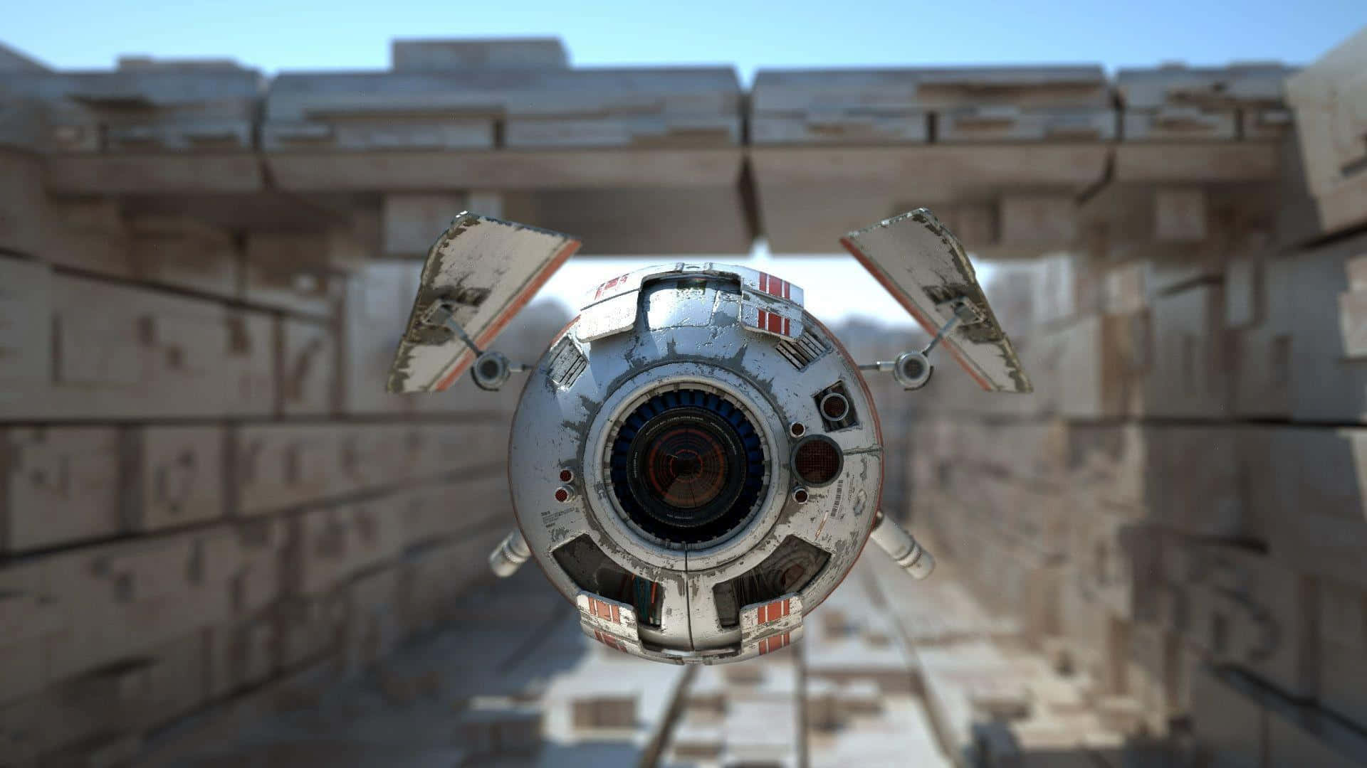 Drone Camera 桌布 壁紙 — 一艘破舊的球形太空船，機翼受損，在晴朗的藍天下盤旋於高聳的混凝土建築之間。