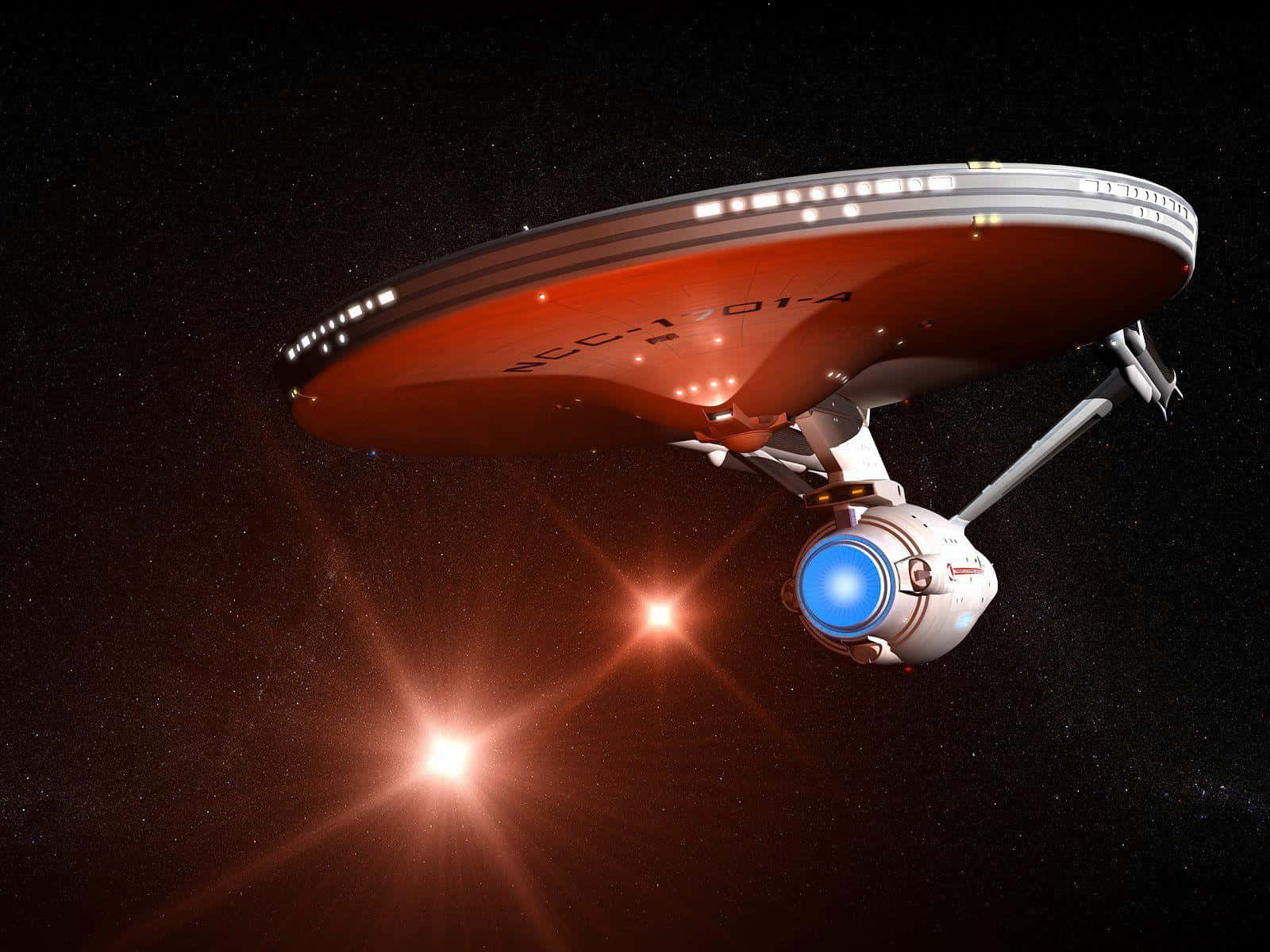星艦NCC-1701在深空中駛過發光的紅色恆星。 — 星際爭霸戰 GIF 壁紙