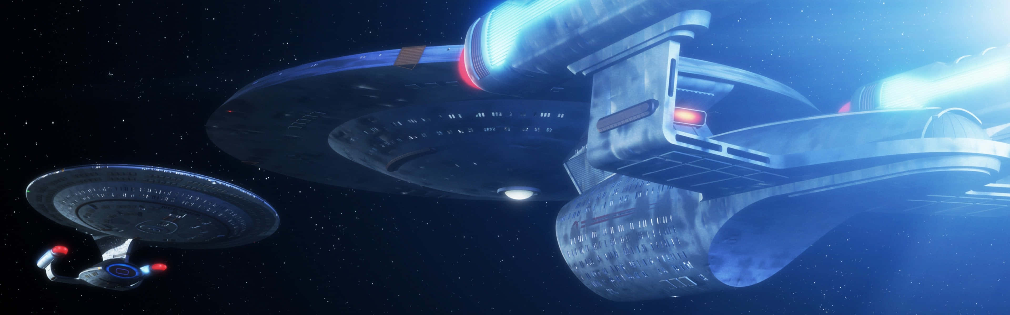 Starship 桌布 壁紙 — 一艘配備發光藍色引擎的星艦在星空中滑行，附近有一艘較小的飛船在軌道上運行。