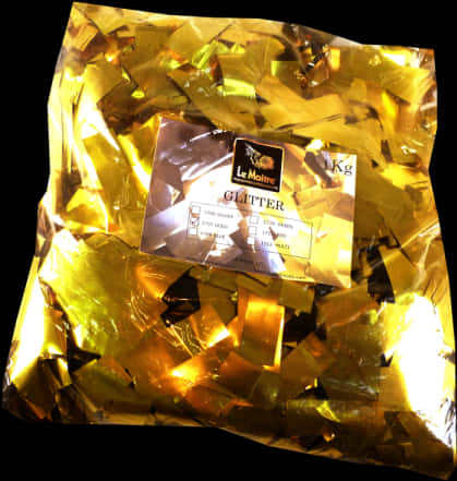 閃爍 桌布 壁紙 — 一袋閃閃發光的金色亮粉，標籤上寫著「Le Maître GLITTER」，背景為黑色。