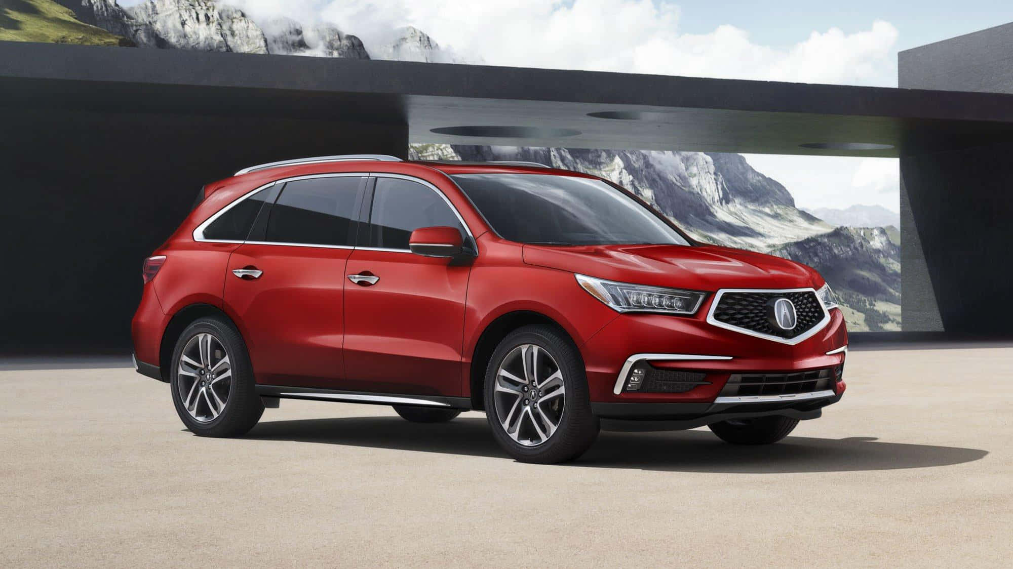 Acura Mdx 桌布 壁紙 — 一輛亮紅色Acura SUV停放在現代建築結構下，背景是雪山。