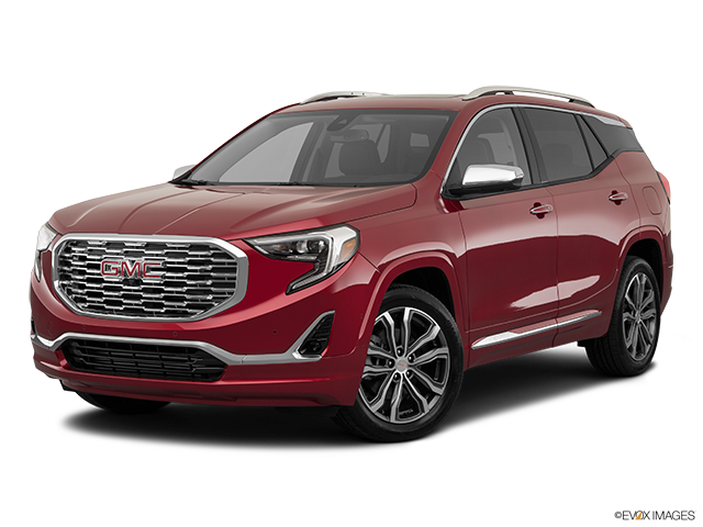 GMC 桌布 壁紙 — 一輛亮紅色的GMC Acadia SUV在攝影棚燈光下展示，帶有鍍鉻飾件和合金輪圈。
