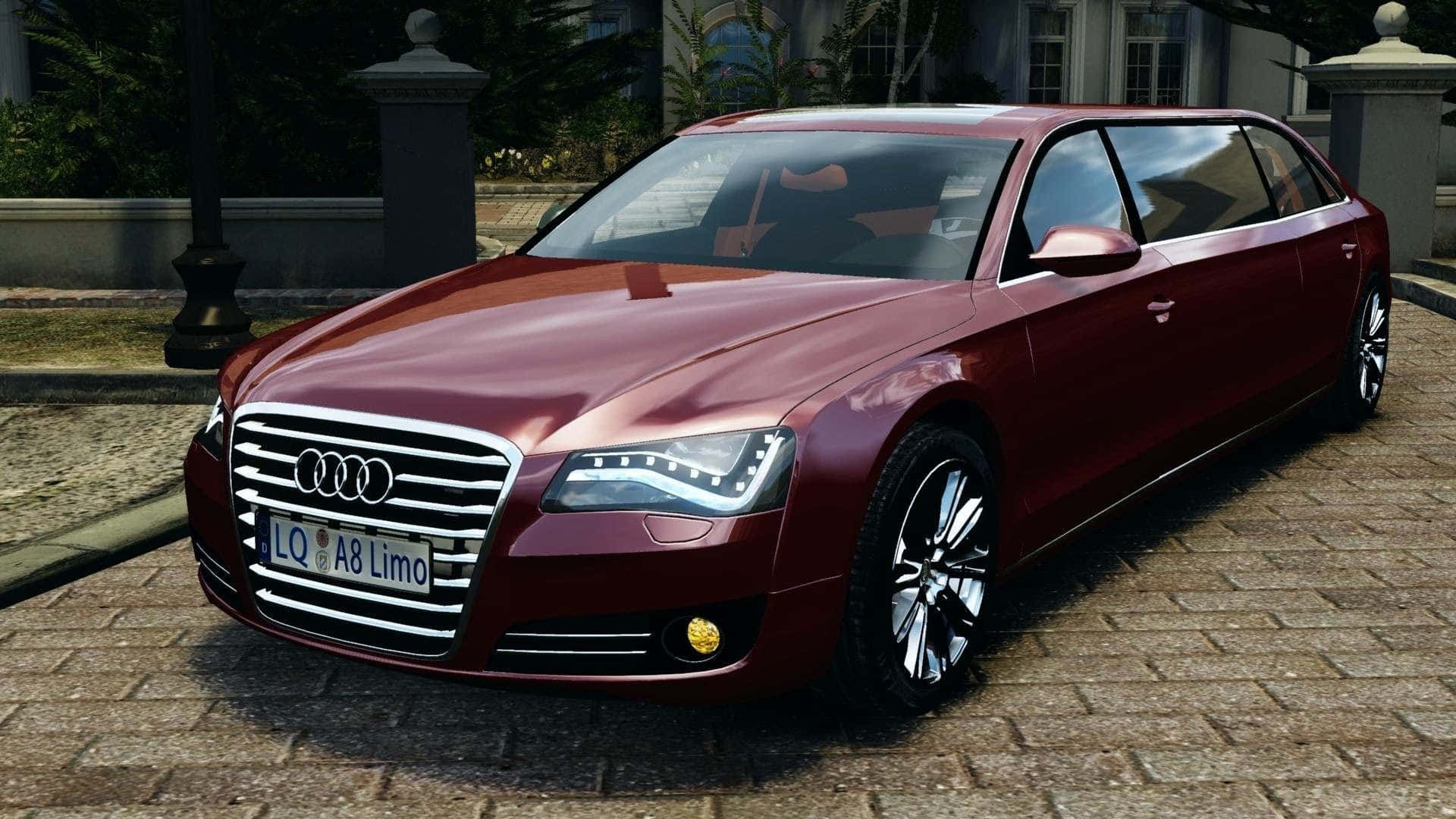 Audi S8 桌布 壁紙 — 一輛亮面棗紅色Audi A8豪華轎車停泊在鵝卵石車道上，旁邊是一座宏偉的豪宅。