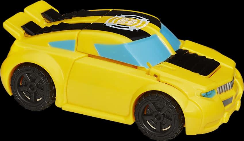 Transformers Bumblebee 桌布 壁紙 — 一輛亮黃色玩具賽車，帶有黑色和藍色點綴，車頂有白色徽章。