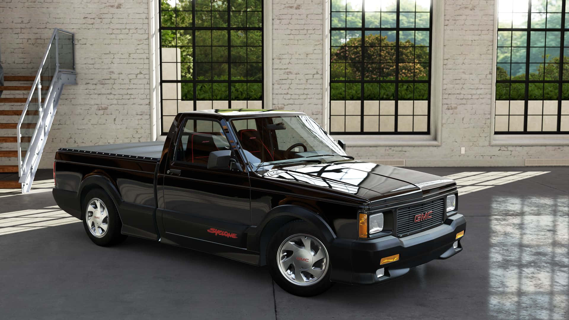 Gmc Syclone 桌布 壁紙 — 一輛亮黑色的GMC Syclone皮卡車停放在一個明亮的工業倉庫內，倉庫有大窗戶和金屬樓梯。
