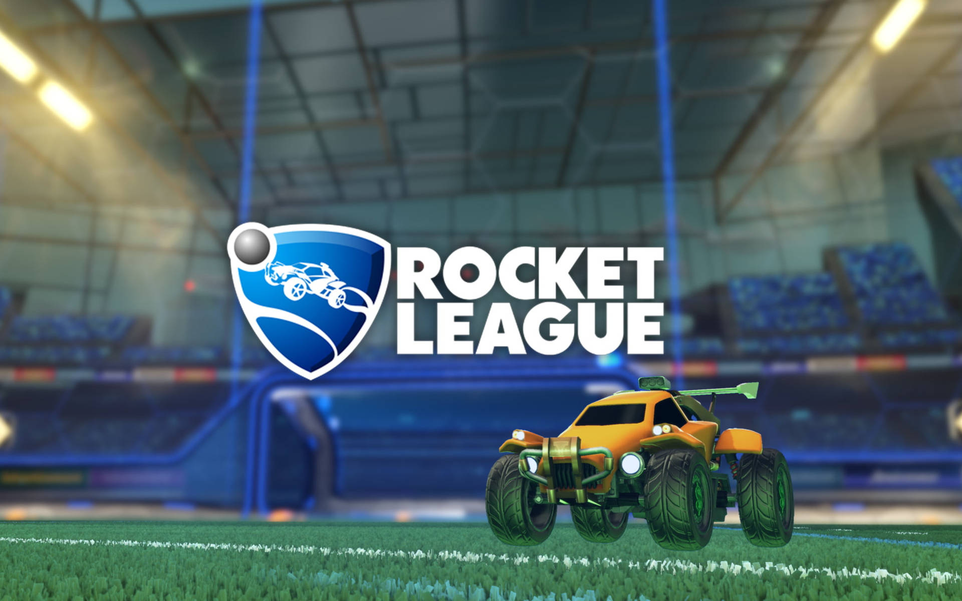 Rocket League 桌布 壁紙 — 一輛充滿活力的橙色怪獸卡車停在綠色場地上，位於未來風格的競技場中，明亮的體育場燈光下，Rocket League 標誌顯眼地展示。