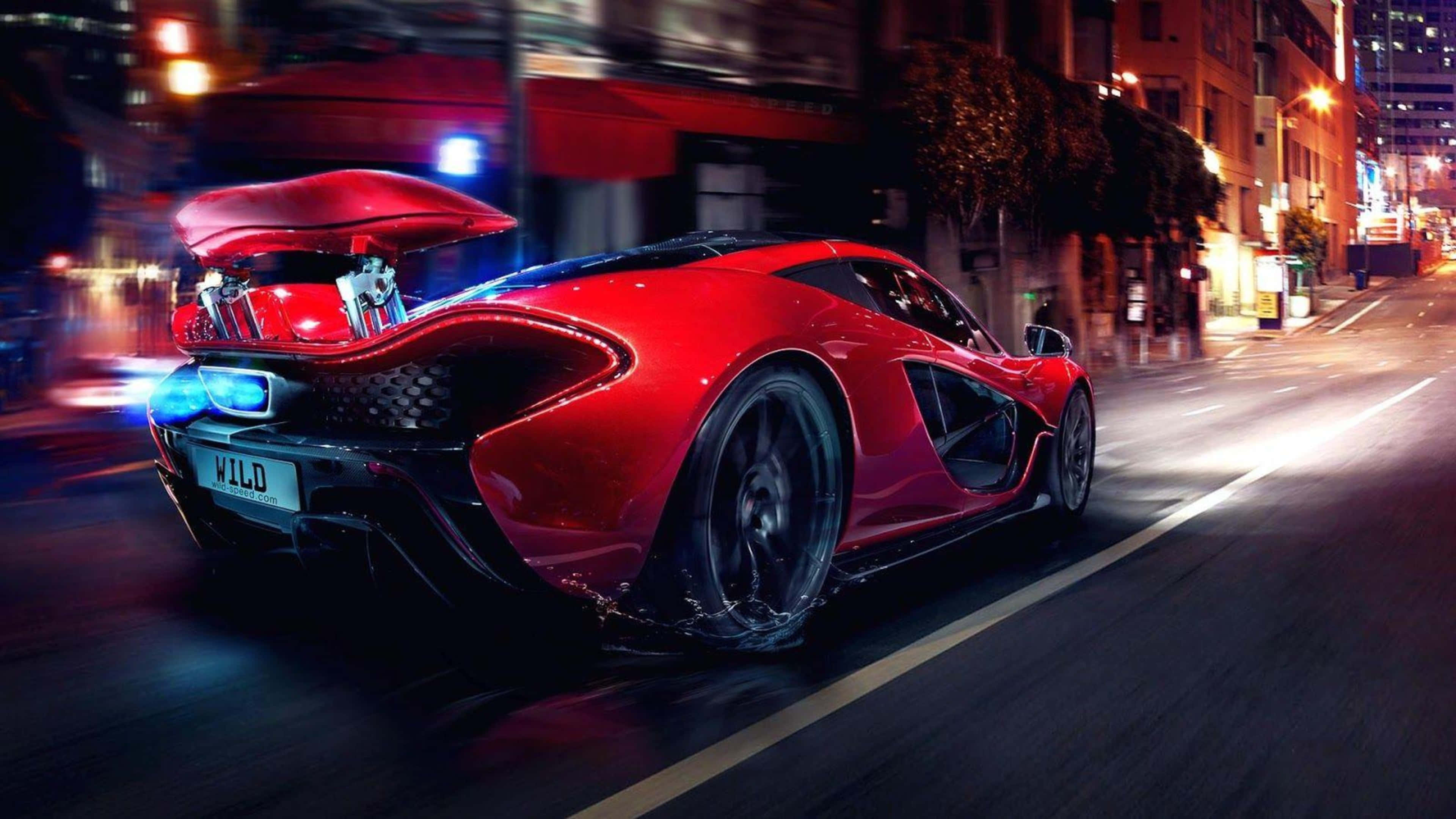 4K汽車 桌布 壁紙 — 一輛充滿活力的紅色McLaren P1超級跑車在夜晚霓虹燈閃爍的街道上疾馳，帶有動態模糊和發光的燈光。