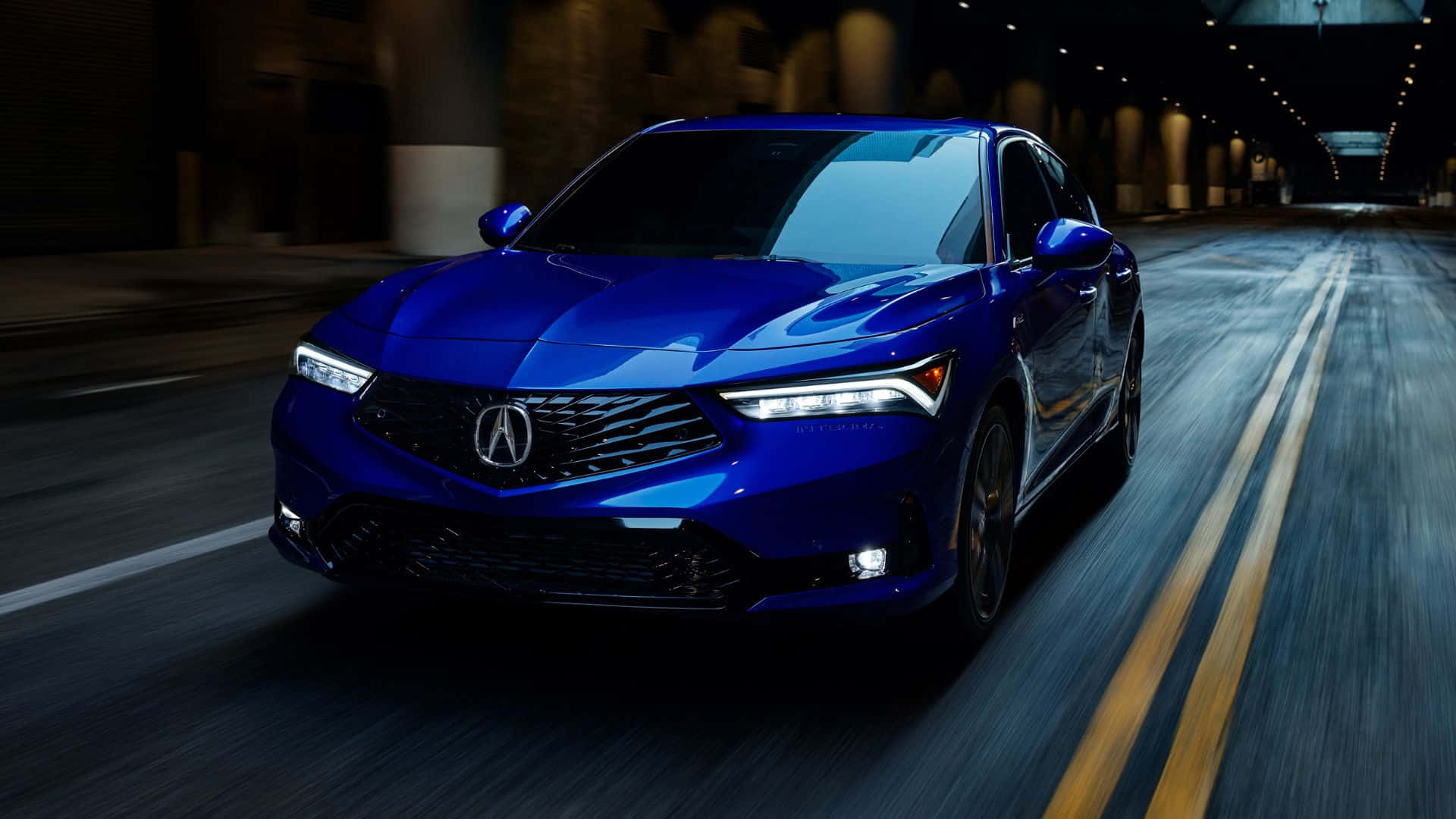 Acura Integra 桌布 壁紙 — 一輛充滿活力的藍色Acura SUV在光線昏暗的隧道中疾馳，路上帶有動態模糊效果。