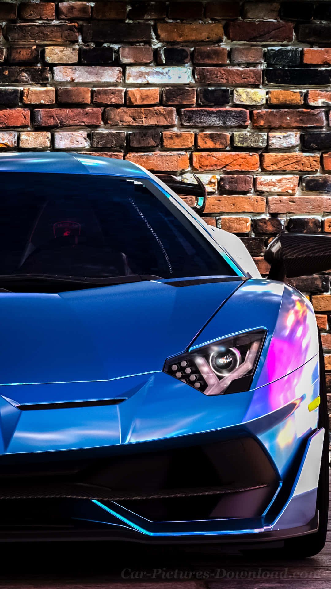 Blue Car 桌布 壁紙 — 一輛充滿活力的藍色藍寶堅尼跑車，亮著發光車頭燈，停靠在風化的磚牆旁。
