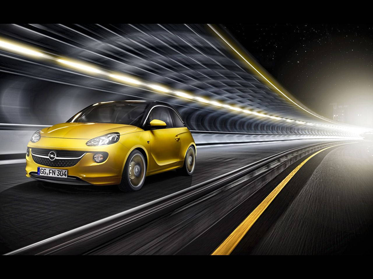 Opel 桌布 壁紙 — 一輛充滿活力的黃色Opel Adam在未來感十足的隧道中疾馳，發光的燈光掠過。