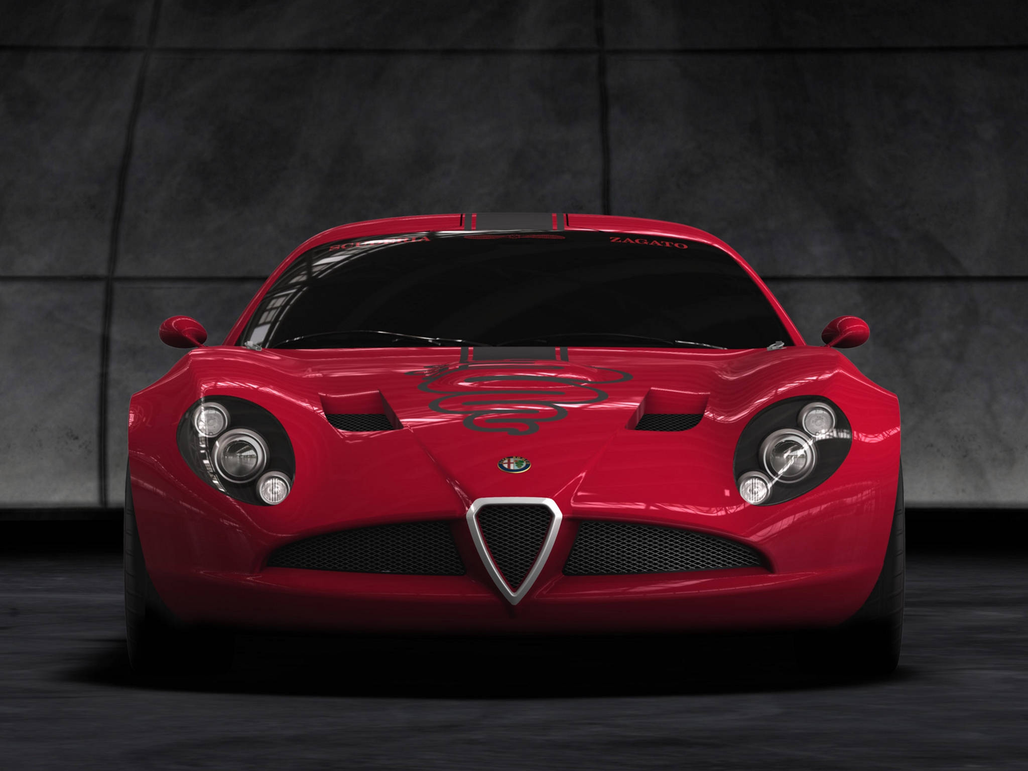 alfa romeo iPhone 桌布 壁紙 — 一輛光亮的紅色愛快羅密歐 Zagato 跑車在光線昏暗的混凝土車庫中，以戲劇性的燈光正面朝前。
