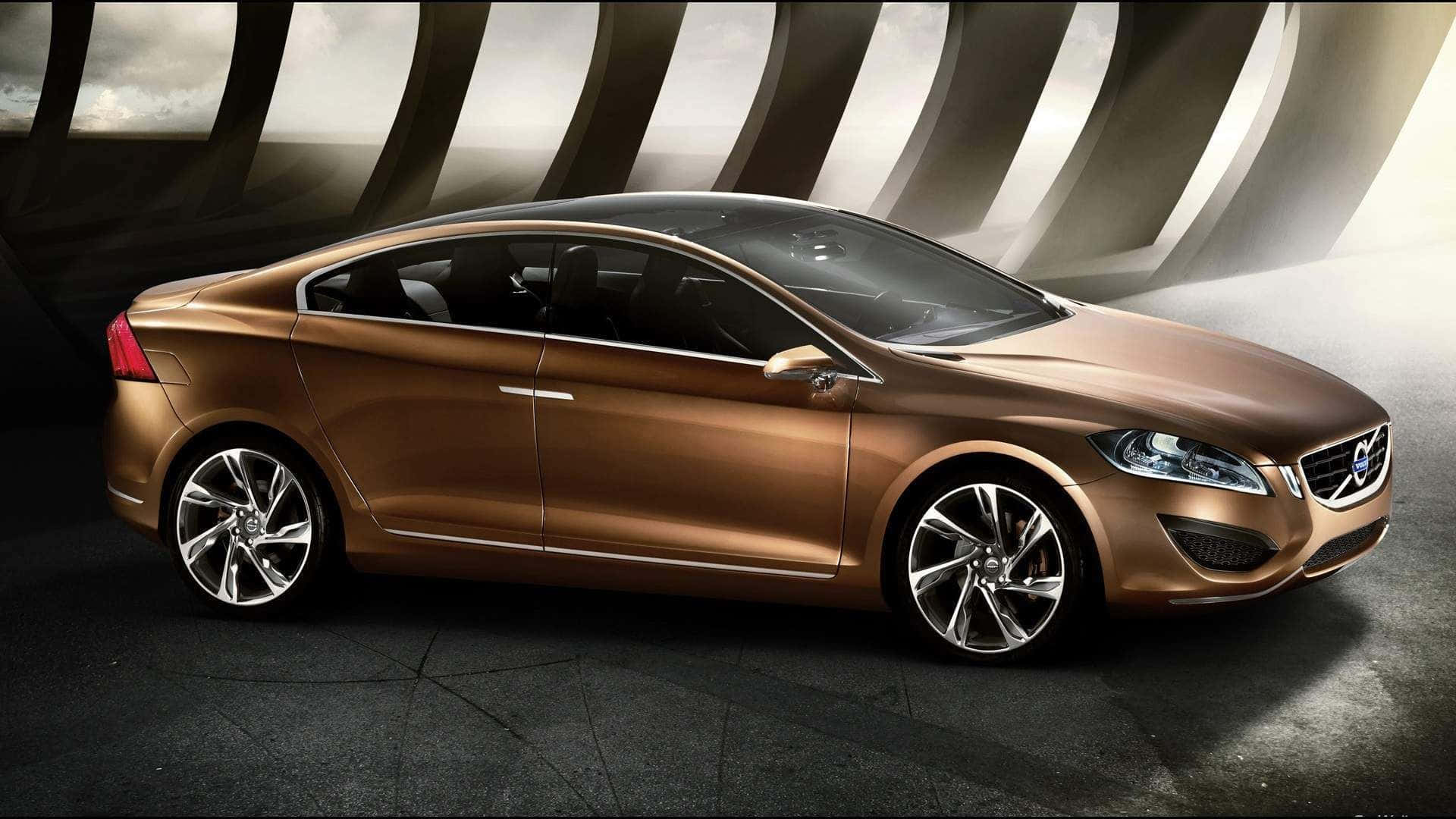 Luxury 桌布 壁紙 — 一輛光滑的青銅色富豪轎車在彎曲的金屬背景前，在攝影棚燈光下閃閃發光。