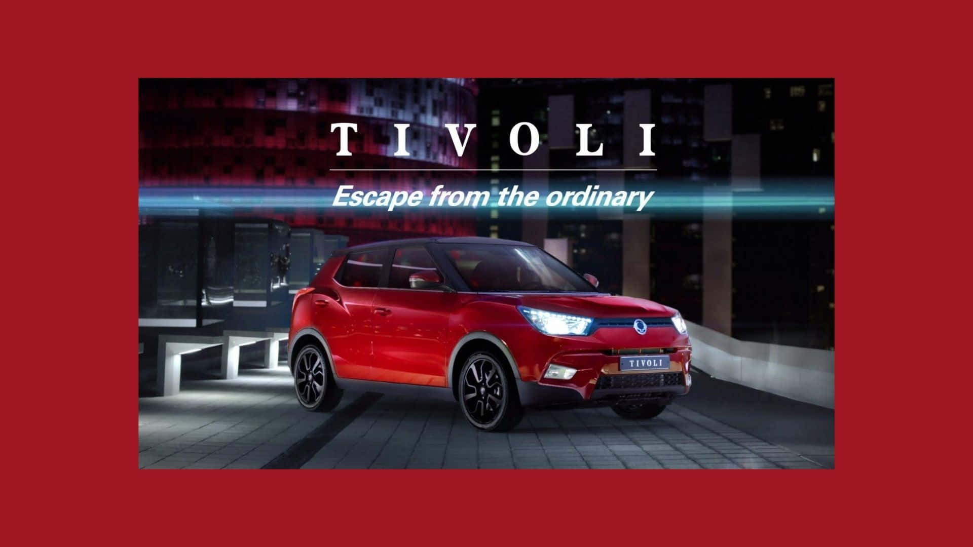 Ssangyong 桌布 壁紙 — 一輛光澤的紅色Tivoli SUV在夜晚的現代屋頂上，在霓虹燈下閃耀，並以粗體文字宣告逃離平凡。