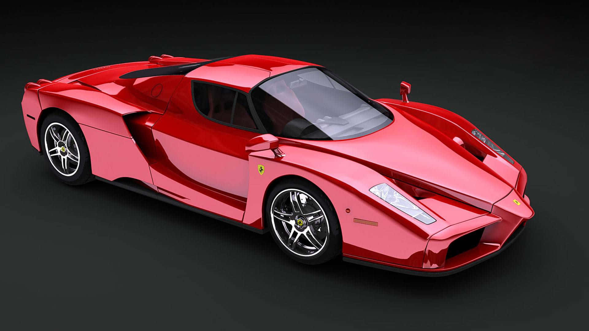 Ferrari Enzo 桌布 壁紙 — 一輛光澤的紅色法拉利Enzo跑車，帶有黑色飾邊和銀色輪圈，在深色工作室背景前展示。