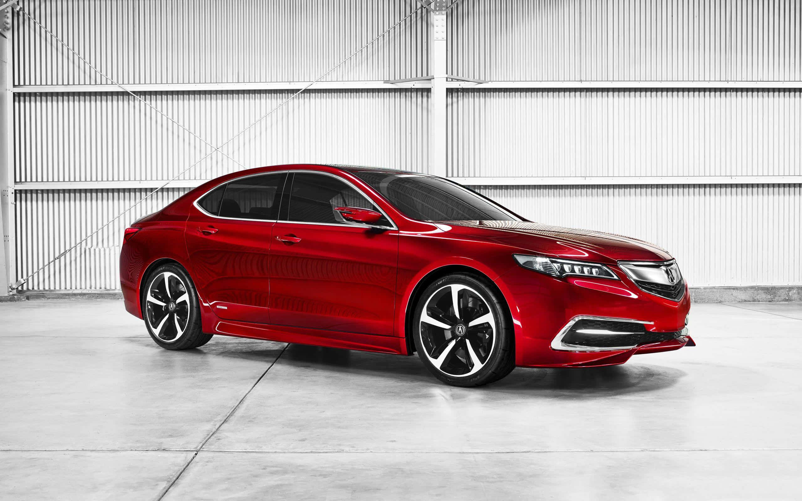 Acura Tlx 桌布 壁紙 — 一輛光澤的紅色轎車在單色波紋金屬倉庫背景下，於攝影棚燈光下閃耀。