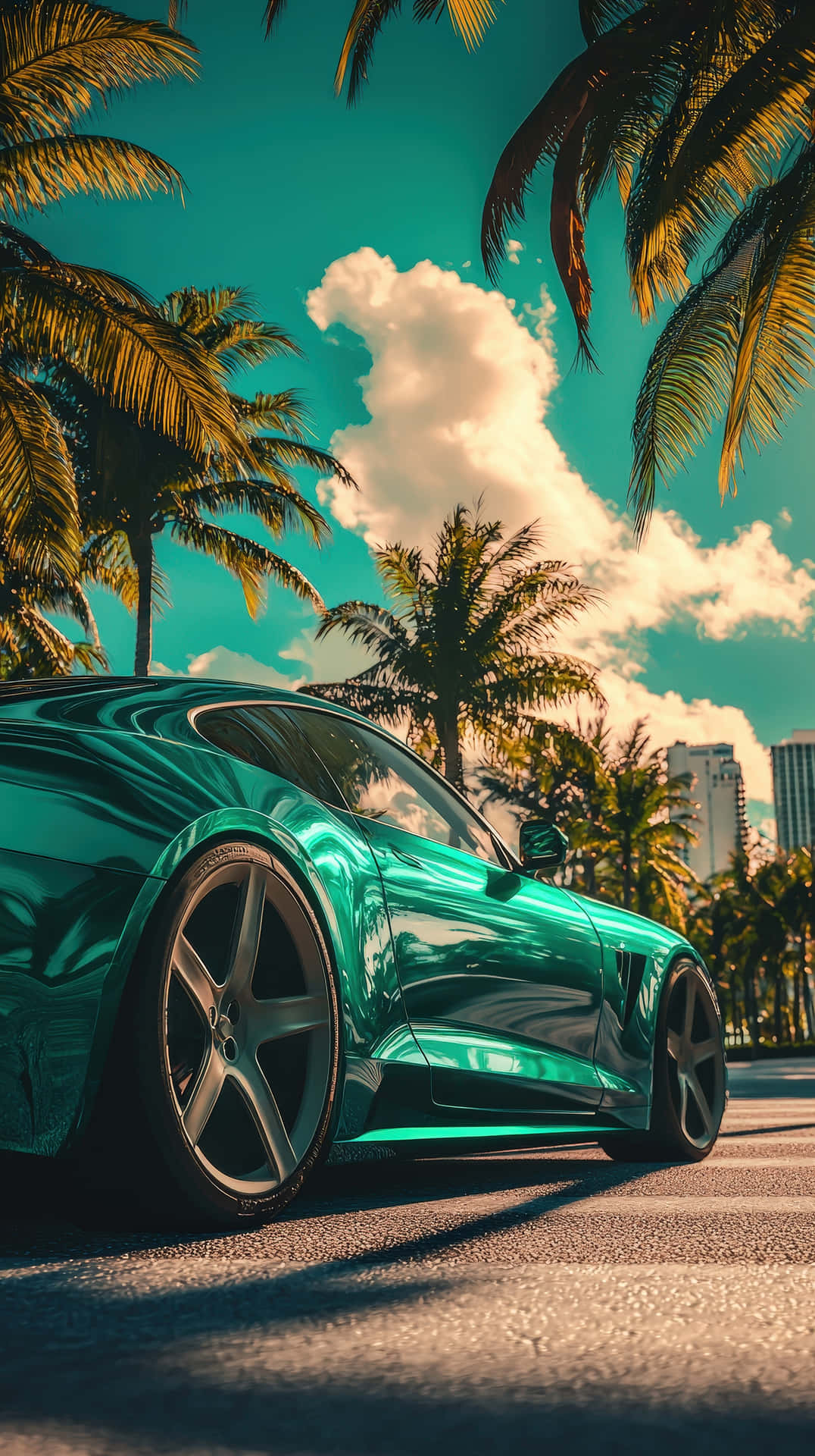 Luxury Sports Car in Tropical Palm Tree Setting 壁紙 — 一輛光澤的藍綠色跑車停放在棕櫚樹下，背景是充滿活力的藍綠色天空和蓬鬆的白雲。