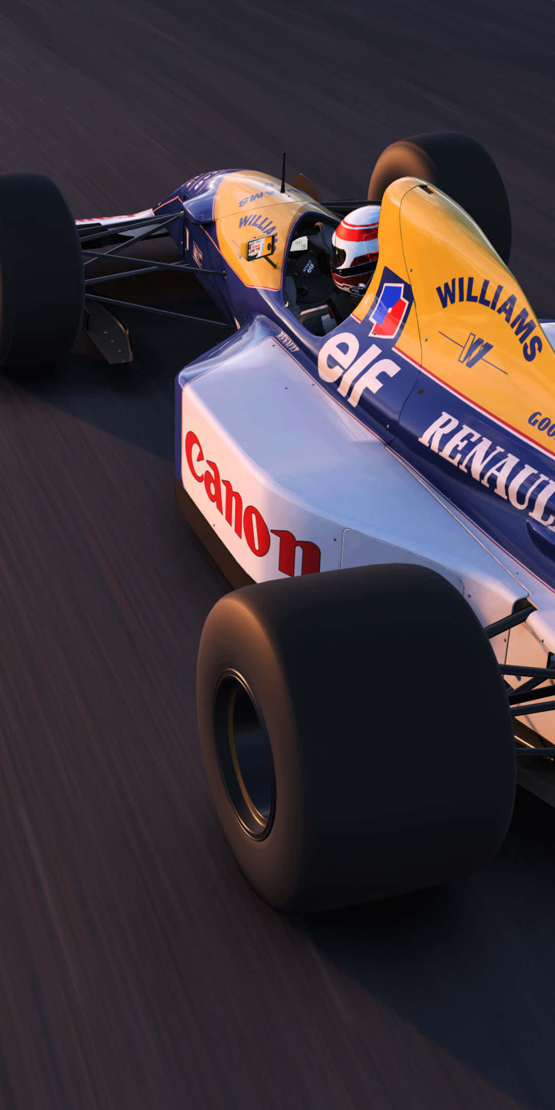 F1 桌布 壁紙 — 一輛威廉斯F1賽車在日落時分沿著賽道疾馳，車身採用鮮豔的黃、藍、白配色。
