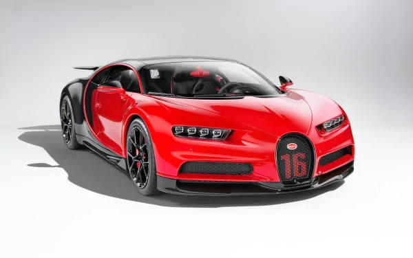 工作室中帶有黑色細節和格柵上16號數字的紅色Bugatti Chiron超級跑車。 — 4K 壁紙