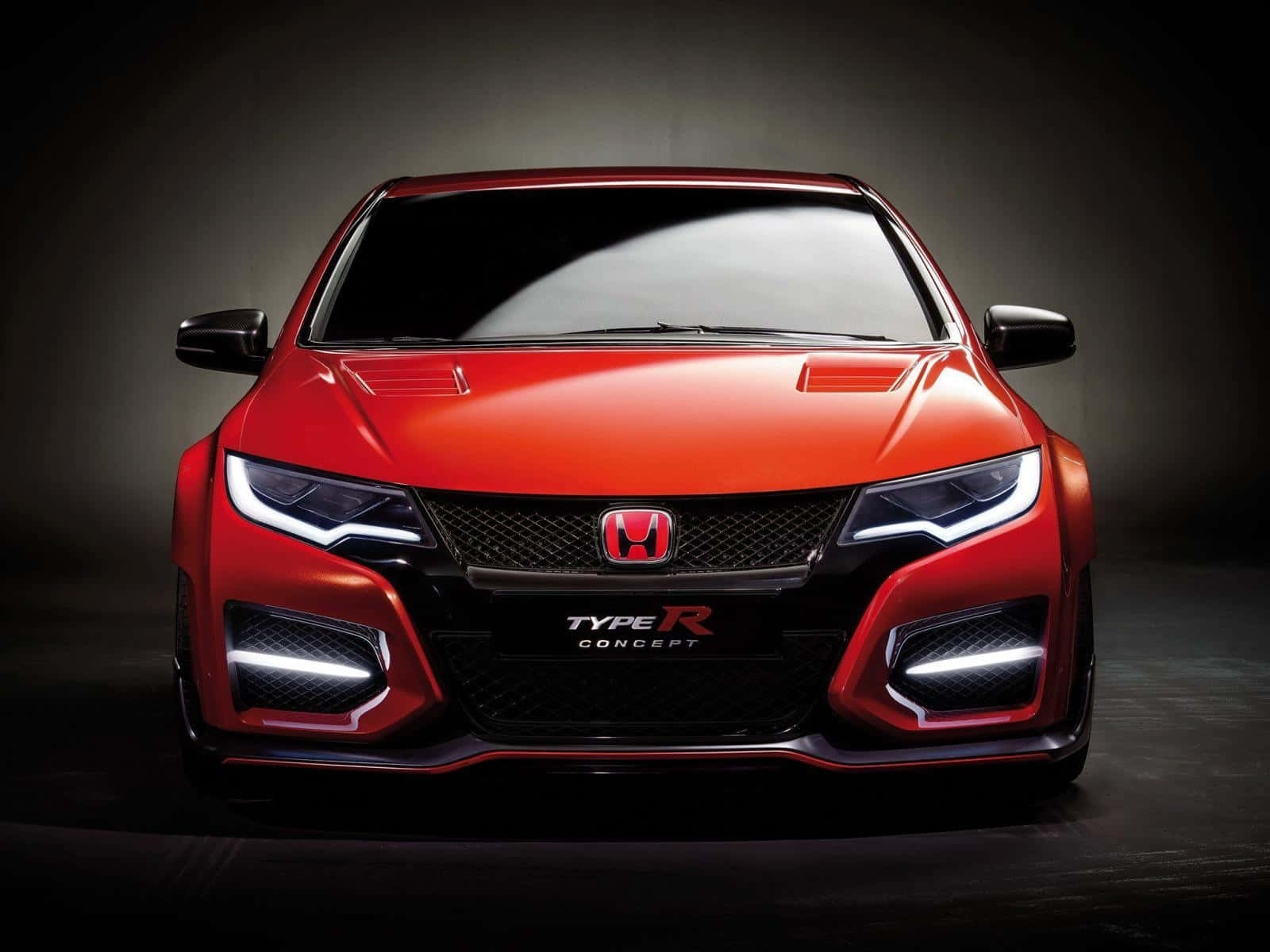 本田 桌布 壁紙 — 一輛引人注目的紅色本田 Type R 概念車，配備發光頭燈和激進的前格柵，在戲劇性的工作室燈光下展示。