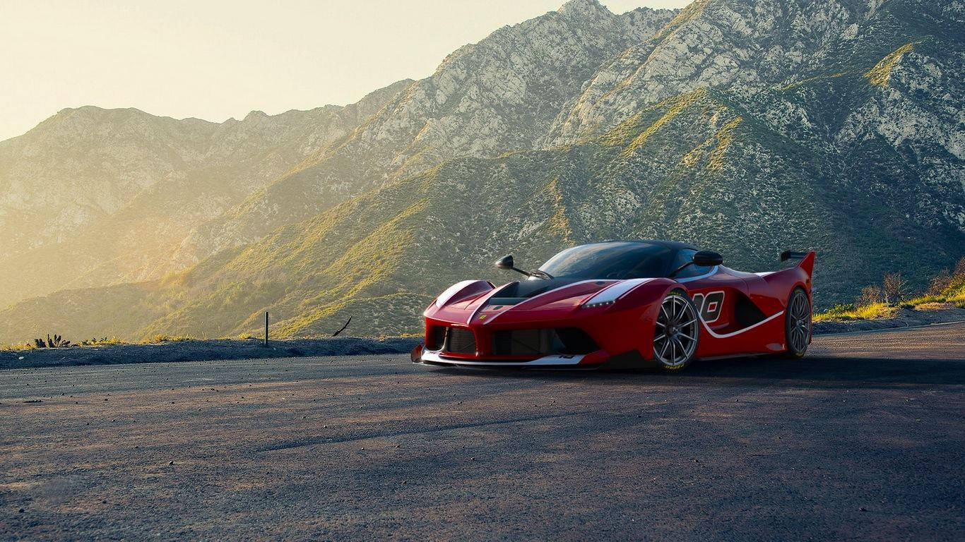 跑車 桌布 壁紙 — 一輛引人注目的紅色法拉利 LaFerrari Aperta 停泊在山路上，正值黃金時刻，背景是崎嶇的山峰。