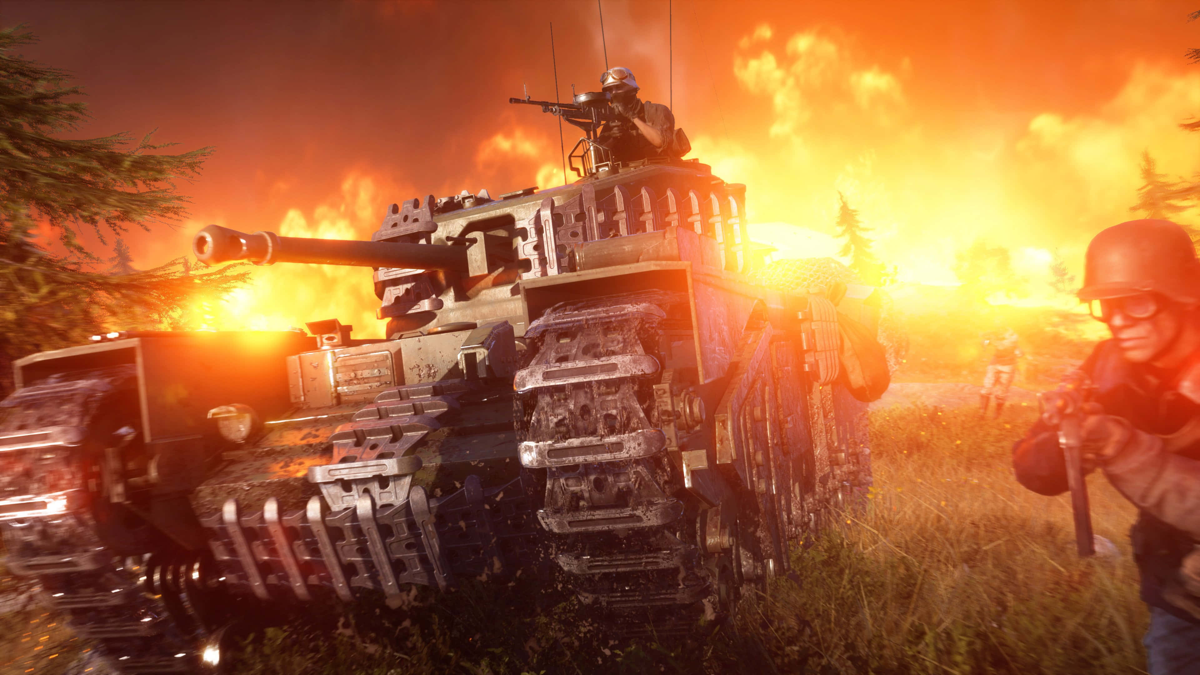 Battlefield Vehicles 桌布 壁紙 — 一輛戰車和一名士兵在熾熱的夕陽天空下穿過草地前進，遠處有爆炸。