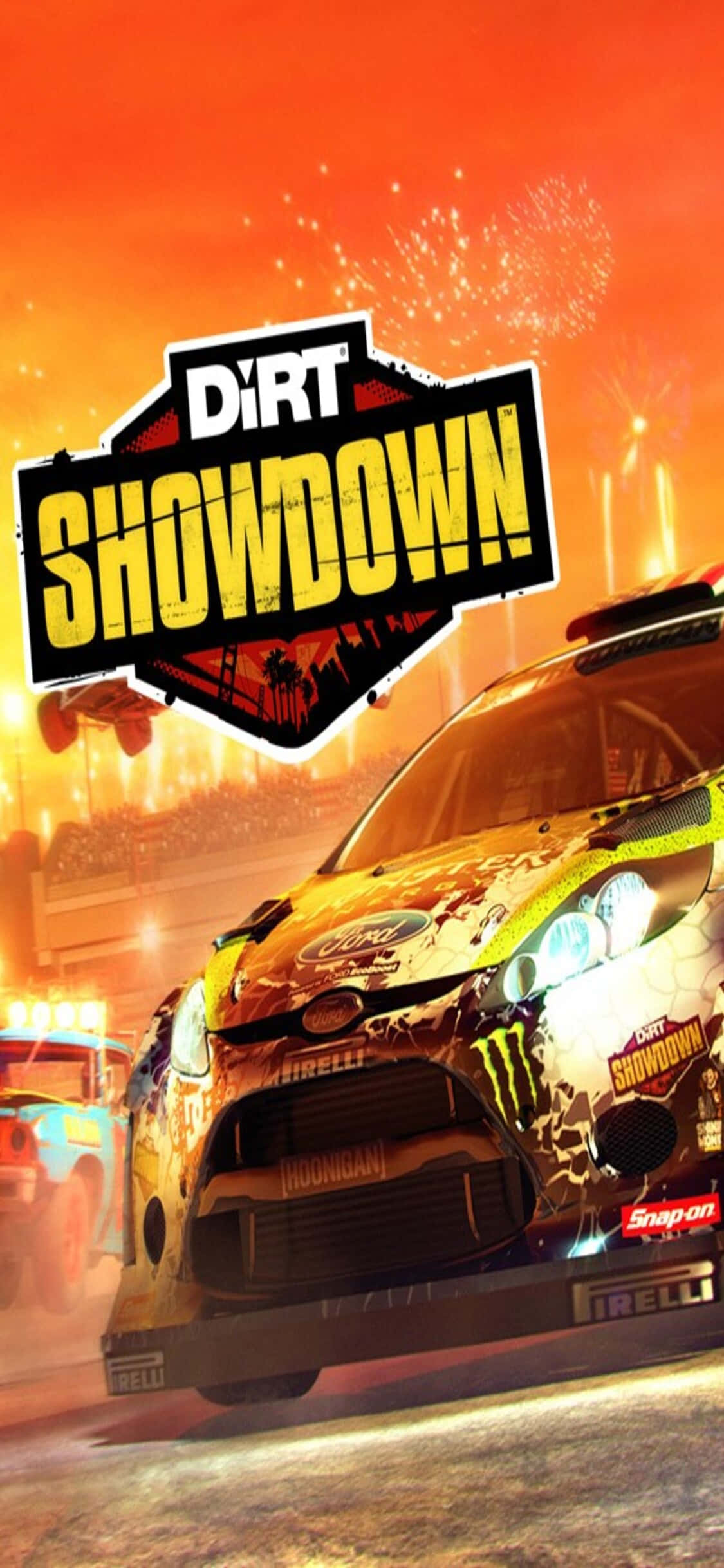 iPhone Xs Dirt Showdown 桌布 壁紙 — 一輛拉力賽車在火熱的橙色體育場中疾馳，煙火在「DiRT SHOWDOWN」標誌上方爆炸。