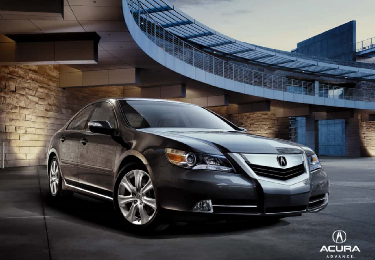 Acura 桌布 壁紙 — 一輛時尚的深灰色Acura轎車在黃昏時停放在現代弧形玻璃和鋼結構建築下。