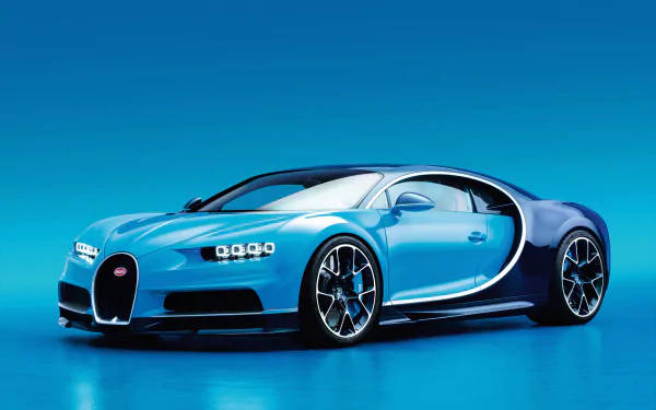 一輛藍色 Bugatti Chiron 跑車在攝影棚燈光下。 — 4K 壁紙