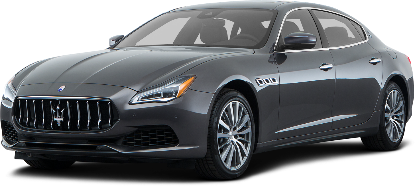 Vehicle 桌布 壁紙 — 一輛時尚的灰色瑪莎拉蒂 Quattroporte 轎車在工作室燈光下閃耀，展示其鍍鉻格柵和合金輪圈。