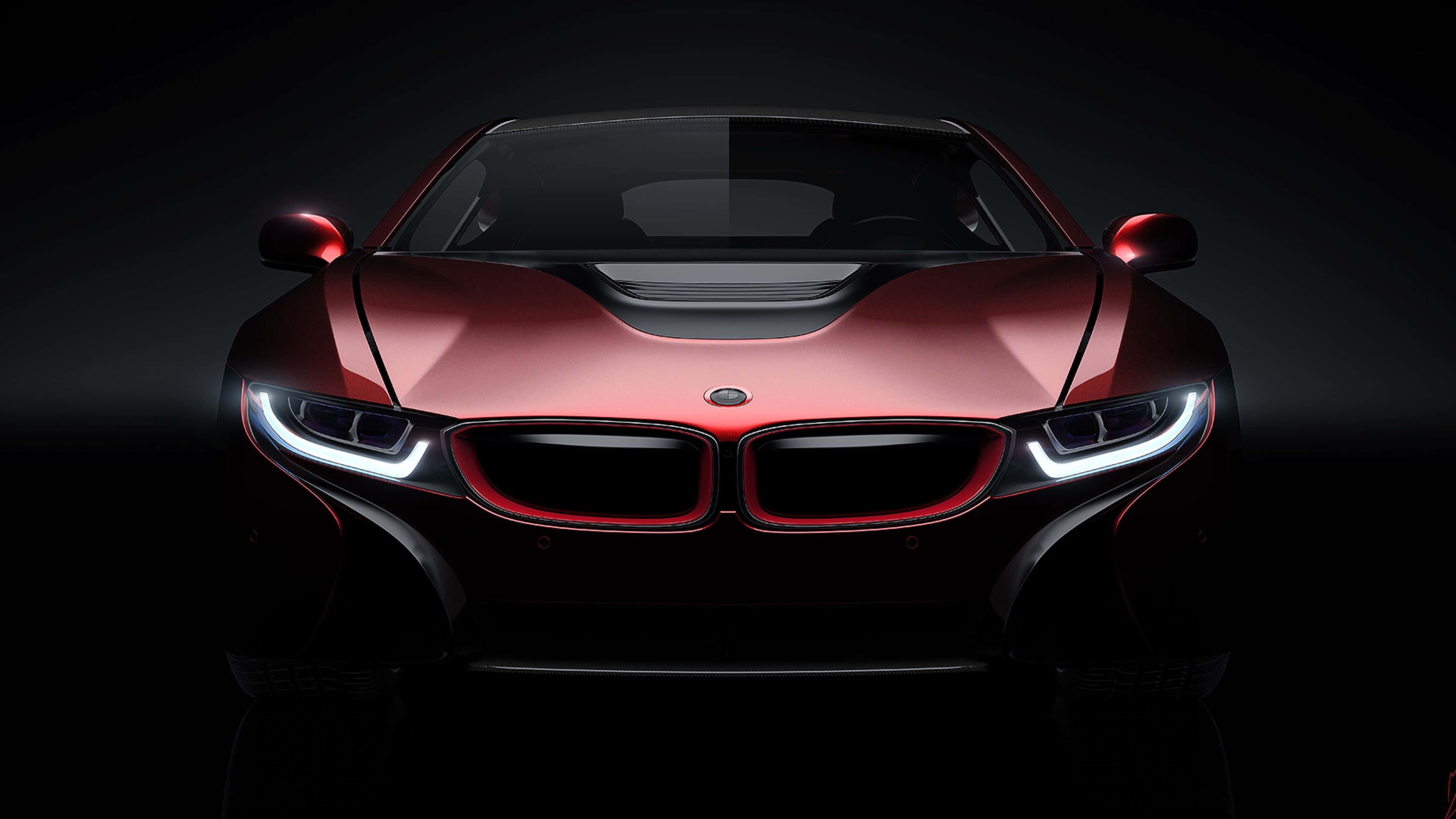 4K BMW 壁紙 桌布 壁紙 — 一輛時尚的紅色BMW跑車在黑暗的攝影棚背景下閃耀著明亮的車頭燈。