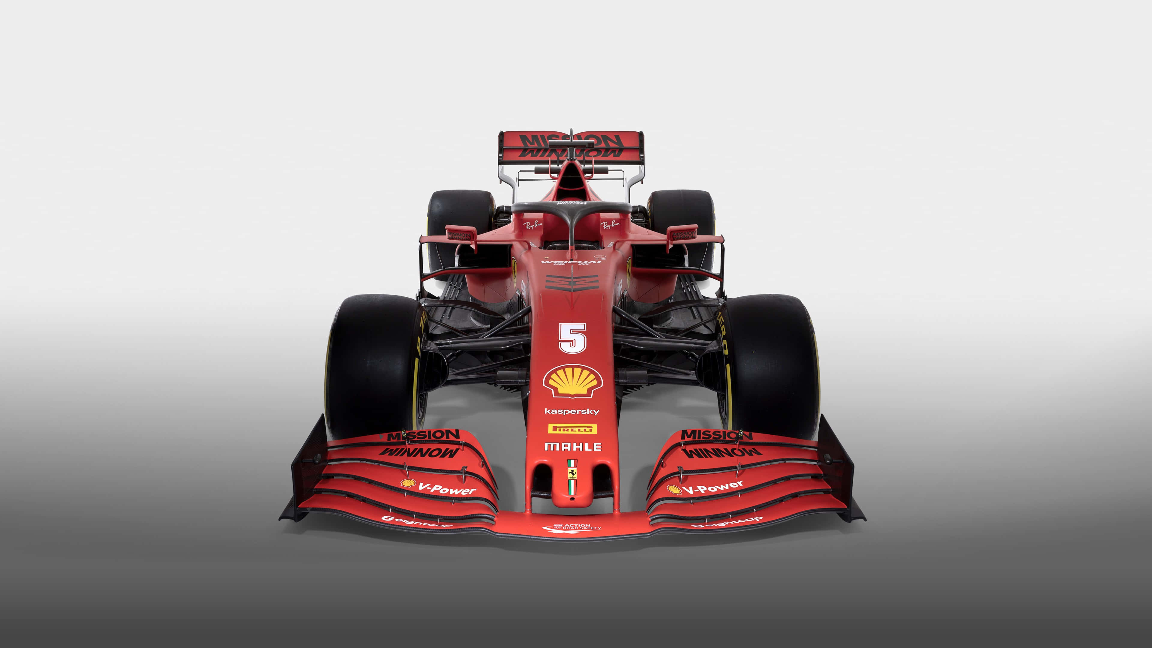 Formula 1 iPhone 桌布 壁紙 — 一輛時尚的紅色法拉利一級方程式賽車，帶有5號和贊助商標誌，正面展示在漸變灰色背景上。