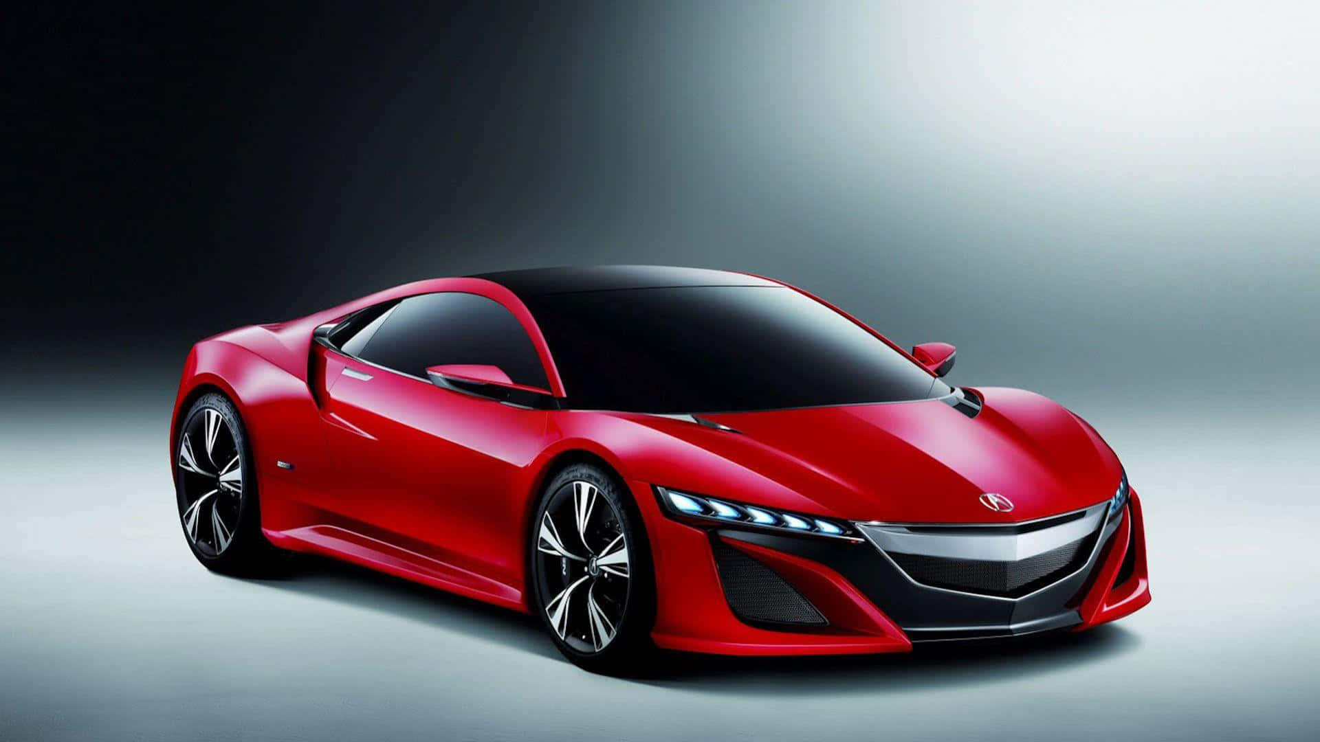 Acura Nsx 桌布 壁紙 — 一輛時尚的紅色跑車，帶有黑色飾邊和發光車頭燈，在漸變工作室背景前展示。