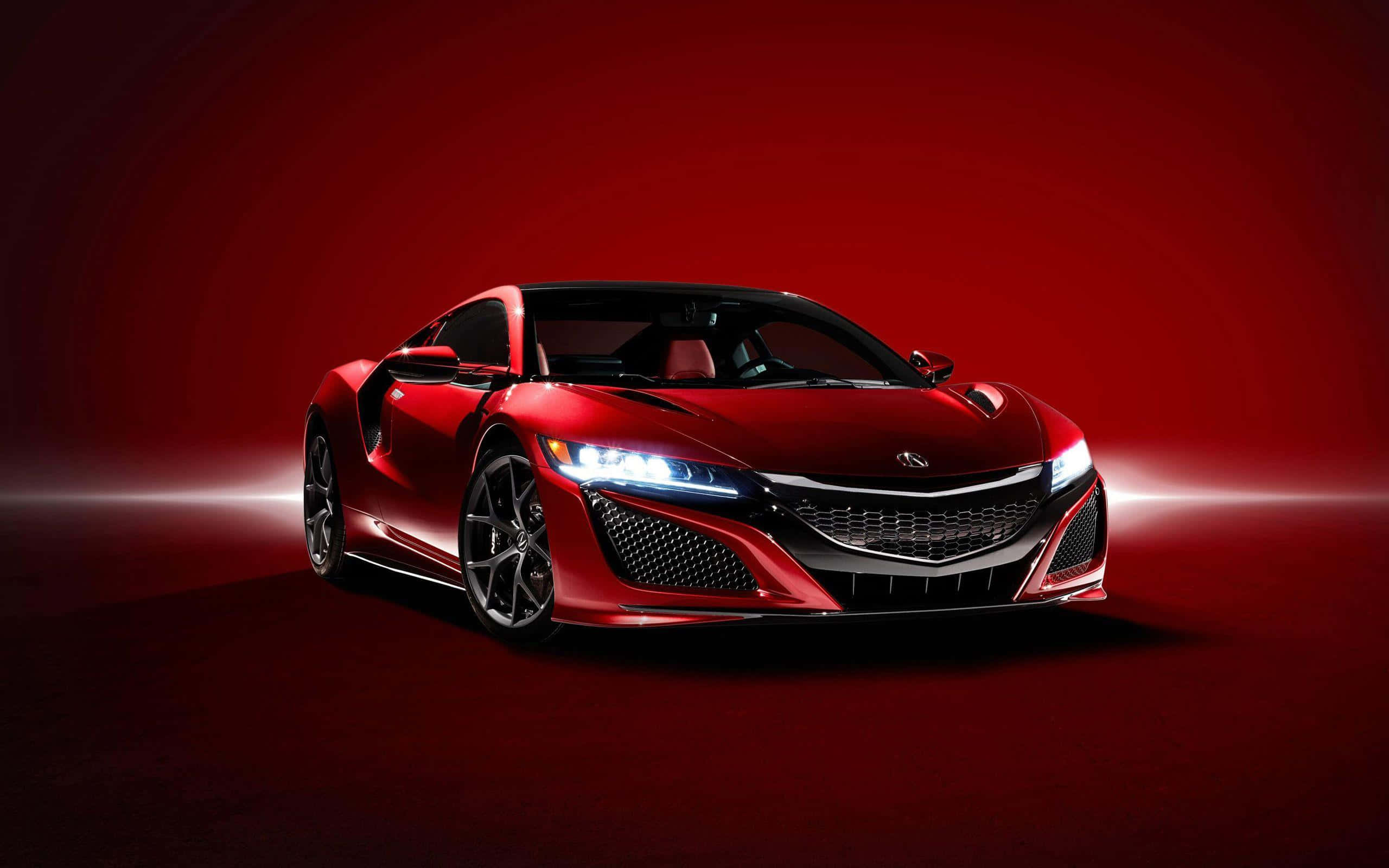 Acura Nsx 桌布 壁紙 — 一輛時尚的紅色跑車在深紅色漸變背景前，在戲劇性的攝影棚燈光下閃耀。