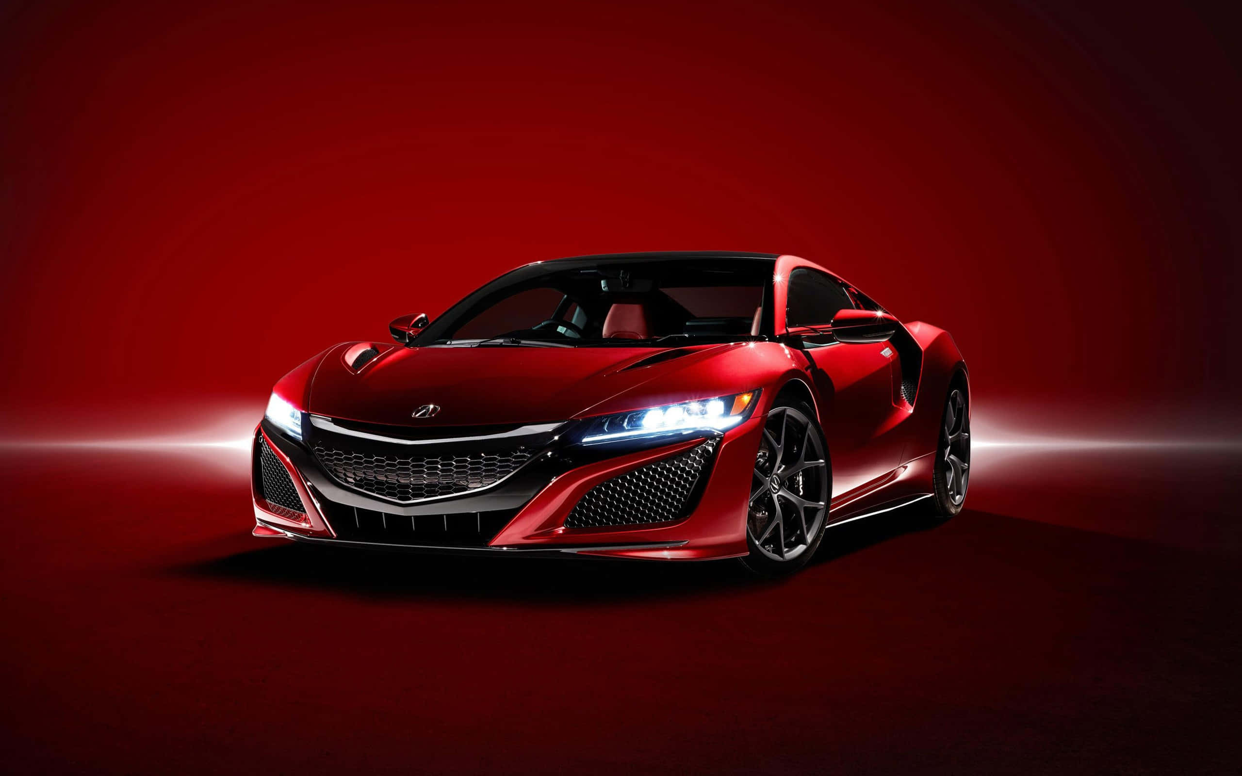 Acura 桌布 壁紙 — 一輛時尚的紅色跑車在漸變紅色工作室背景中，帶有發光的燈光條紋，閃爍著銳利的車頭燈。