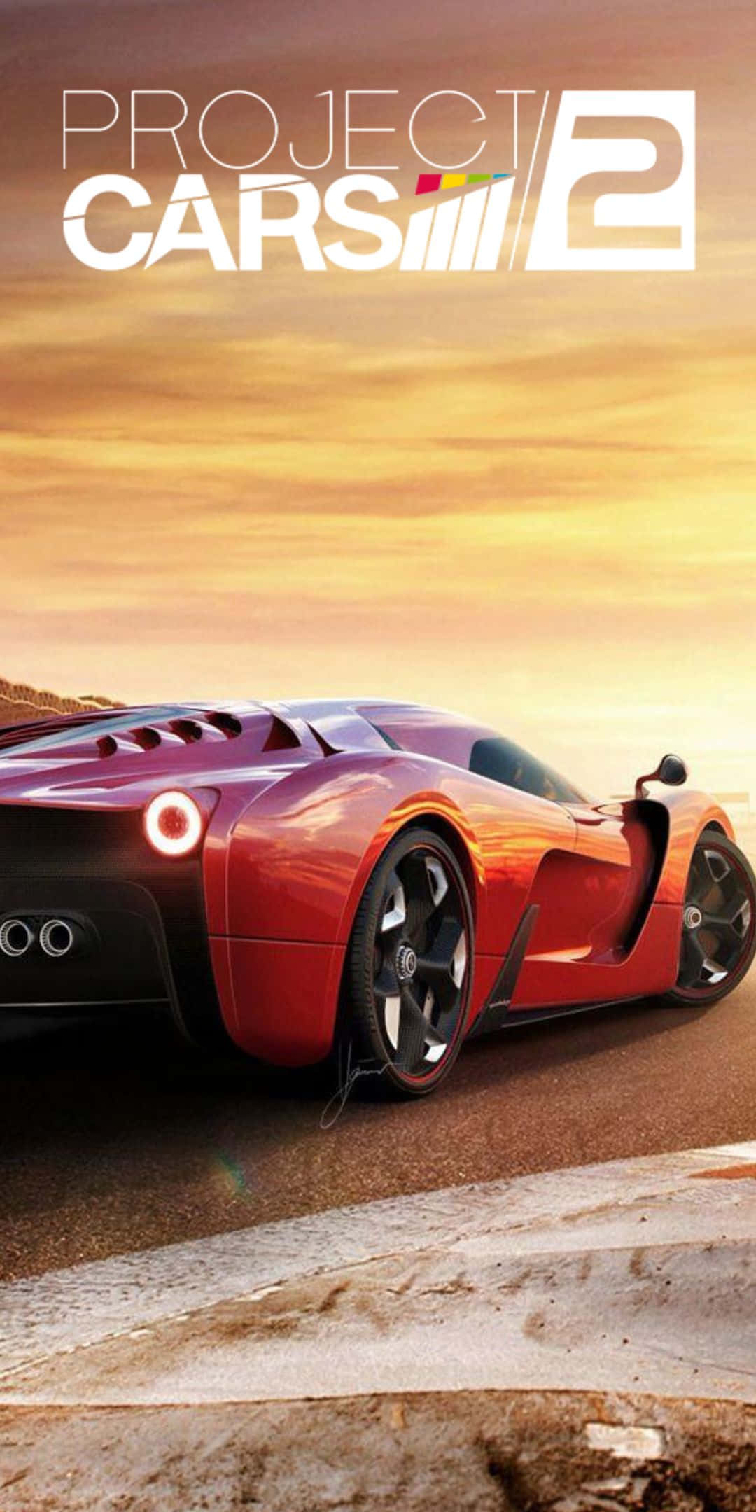 Pixel 3 Project Cars 2 桌布 壁紙 — 一輛時尚的紅色跑車在金色夕陽天空下的沙漠賽道上飛馳，上方有遊戲標題文字。