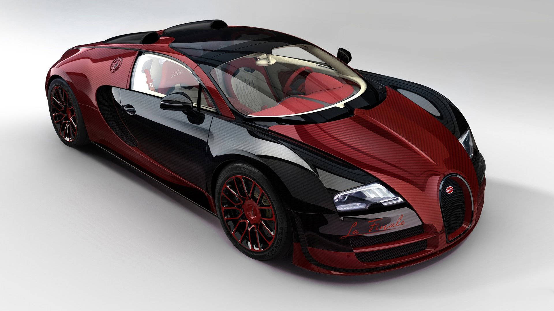 Cool Bugatti 桌布 壁紙 — 一輛時尚的紅黑Bugatti Veyron La Finale，帶有碳纖維細節和紅色內飾，在工作室燈光下展示。