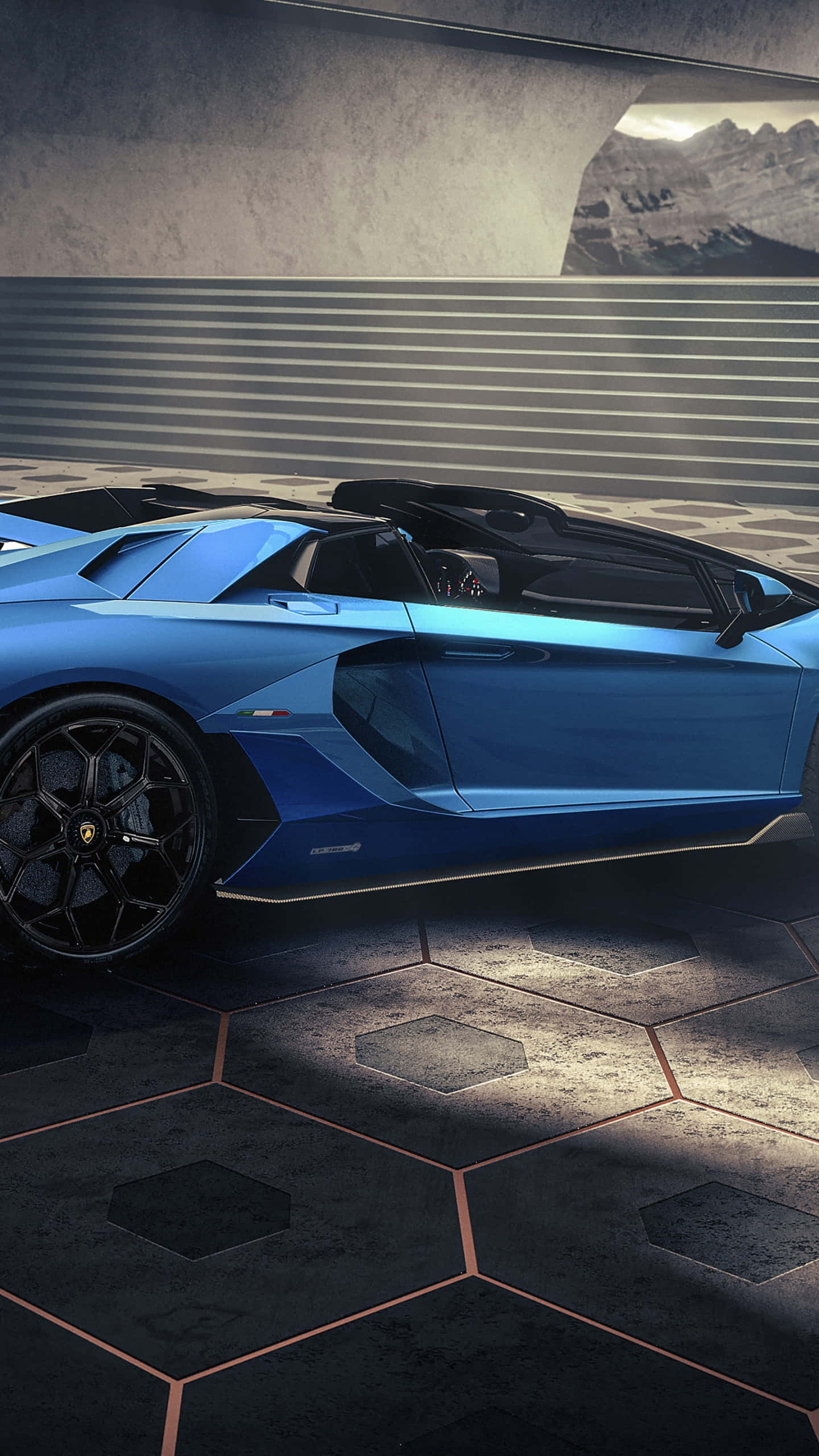 Blue Lamborghini iPhone 桌布 壁紙 — 一輛時尚的藍色藍寶堅尼跑車停放在六角形地板上，透過混凝土拱門可欣賞山景。