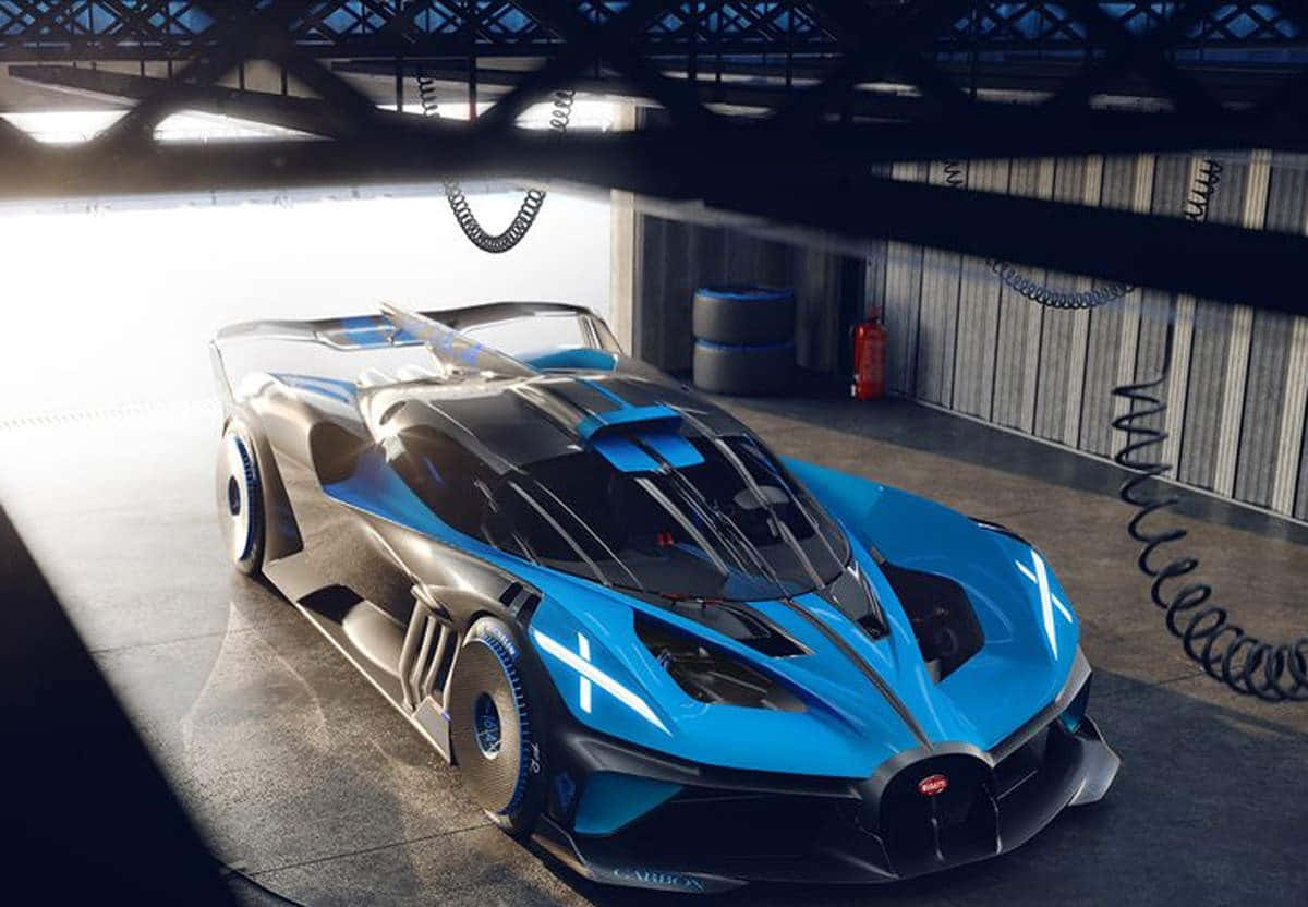 布加迪 桌布 壁紙 — 一輛時尚的藍黑 Bugatti Vision Gran Turismo 概念車在高科技車庫的戲劇性燈光下閃閃發光。
