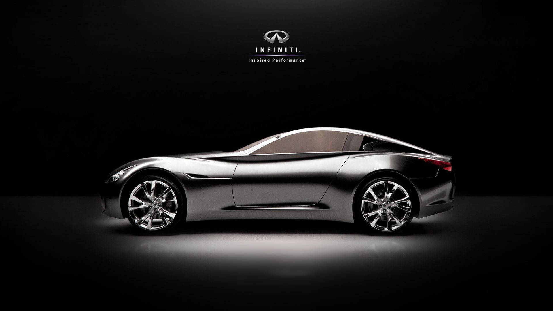 Infiniti 桌布 壁紙 — 一輛時尚的銀色 Infiniti 概念車在黑色背景的攝影棚燈光下閃耀，並帶有品牌標誌。