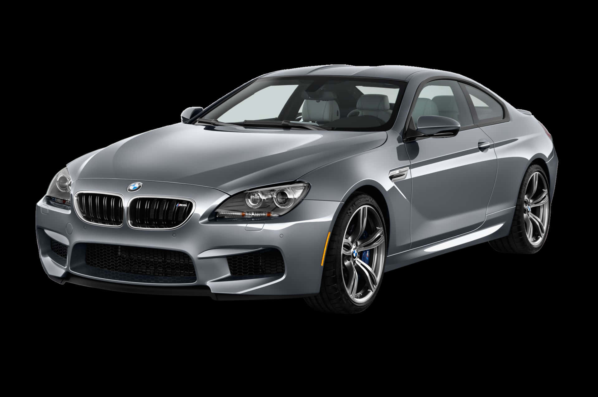 Bmw M6 桌布 壁紙 — 一輛時尚的銀色BMW M6轎跑車在純黑色背景下的攝影棚燈光中閃耀，展現其激進的空氣動力學設計。