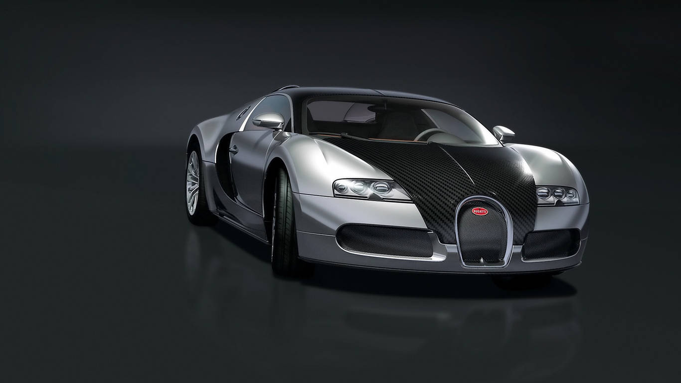 跑車 桌布 壁紙 — 一輛時尚的銀色Bugatti Veyron配以碳纖維飾邊，在黑暗反光地板上於工作室燈光下閃閃發光。