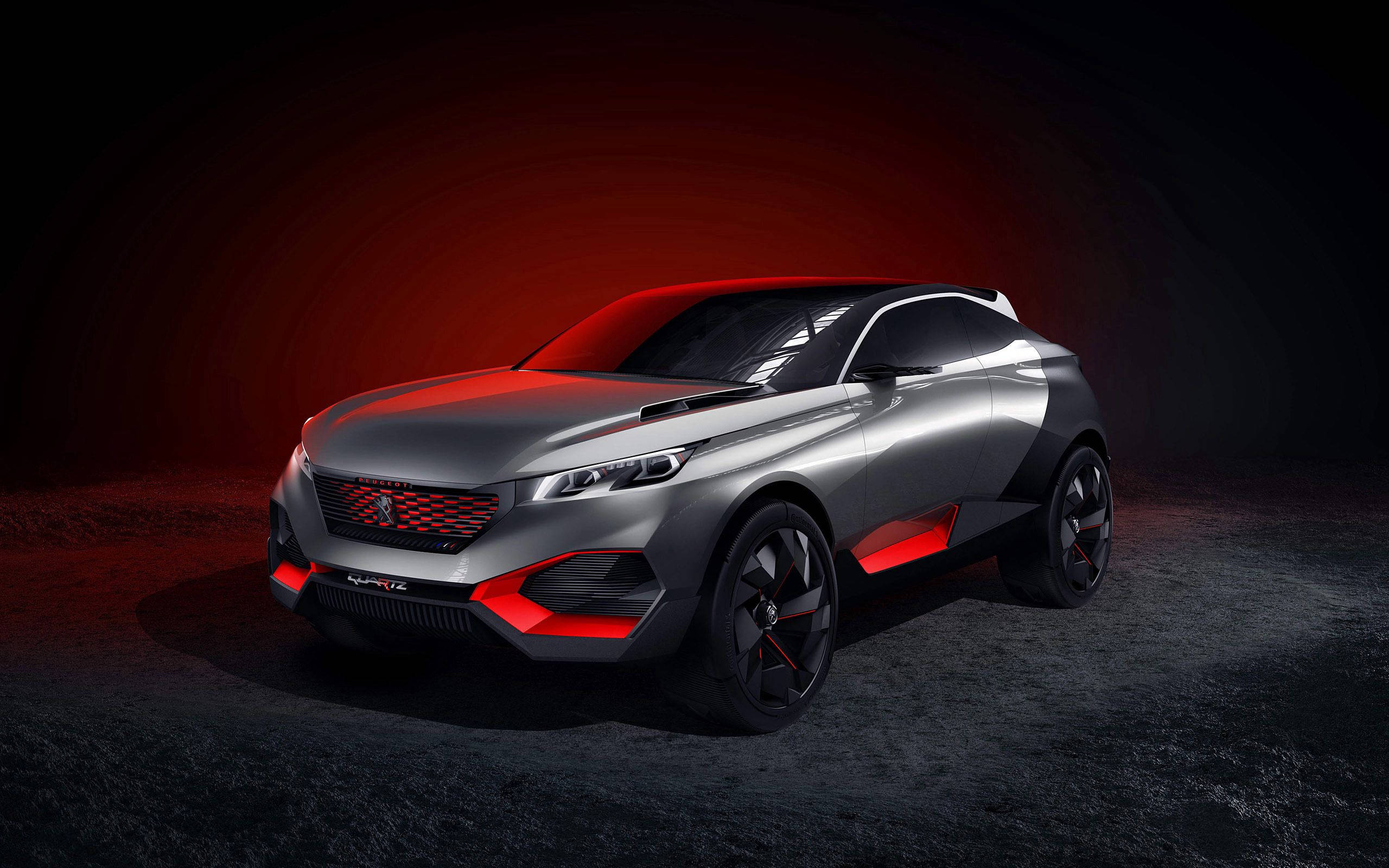Peugeot 桌布 壁紙 — 一輛時尚的銀色概念車帶有紅色點綴，在黑暗的攝影棚中，在戲劇性的紅光下閃耀。