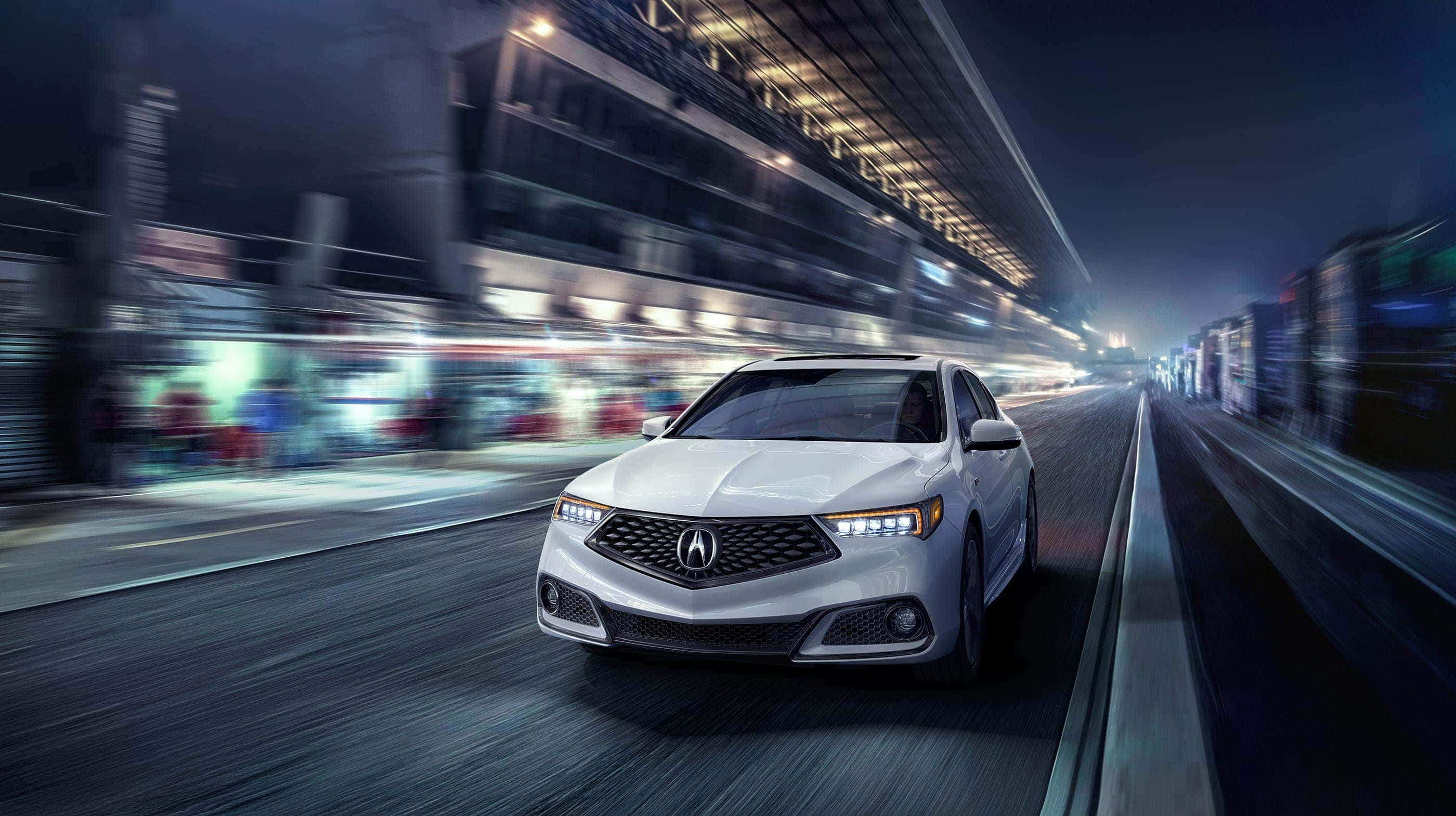 Acura Tlx 桌布 壁紙 — 一輛時尚的銀色轎車在夜間穿過霓虹燈照亮的城市隧道，帶有動態模糊效果。
