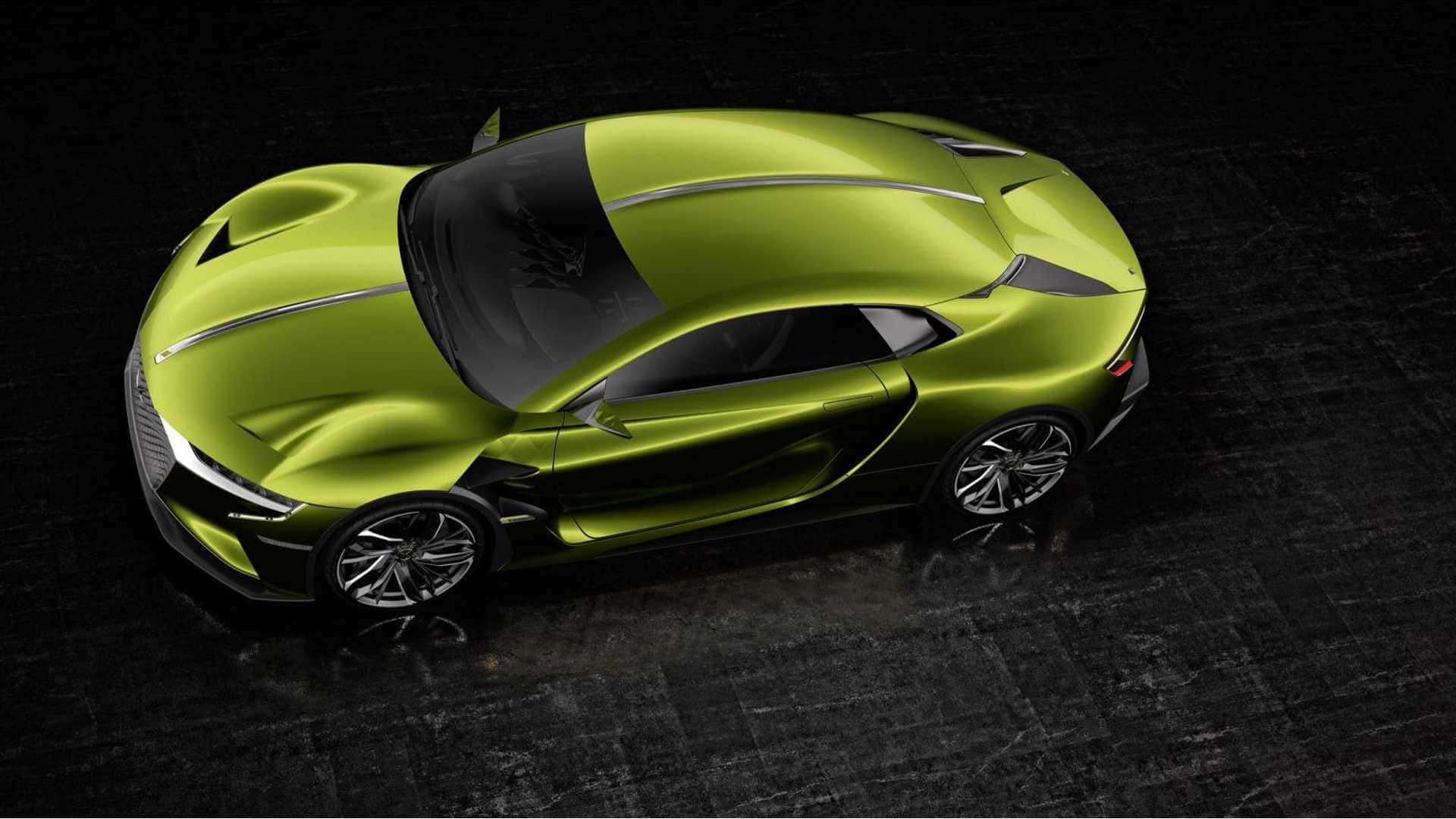 Ds Automobiles 桌布 壁紙 — 一輛時尚的青檸綠色跑車，具有空氣動力學曲線和銀色飾邊，在工作室燈光下停放在深色紋理地板上。